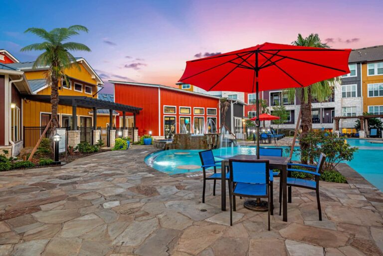 Our Sonterra apartments have poolside tables and chairs.