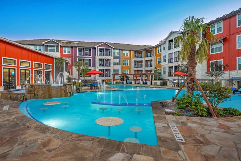 Our Sonterra apartments have tables and chair built in to the resort-style pool.